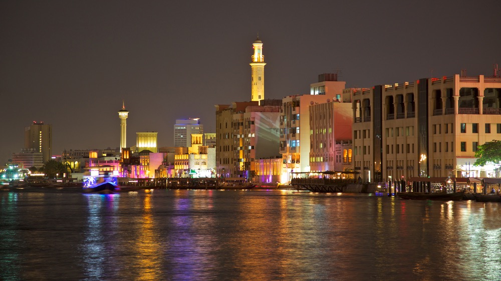 A night-time view of the Bur Dubai side of Dubai Creek, looking towards the Textile Souk.